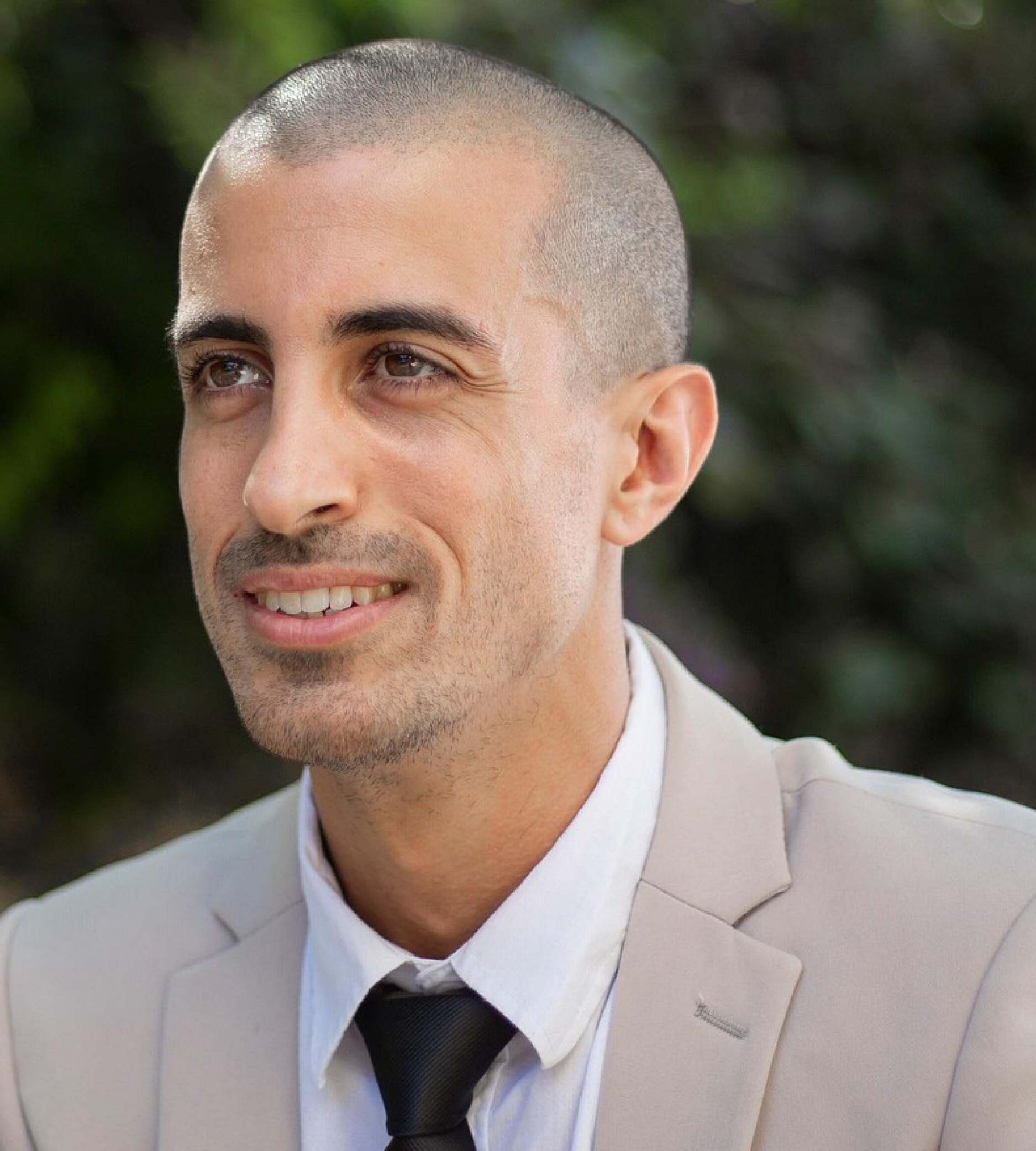 Young professional in grey suit with Black Tie.